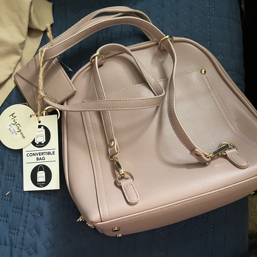 Brand anew with tags. Miztique beautiful convertible purse.